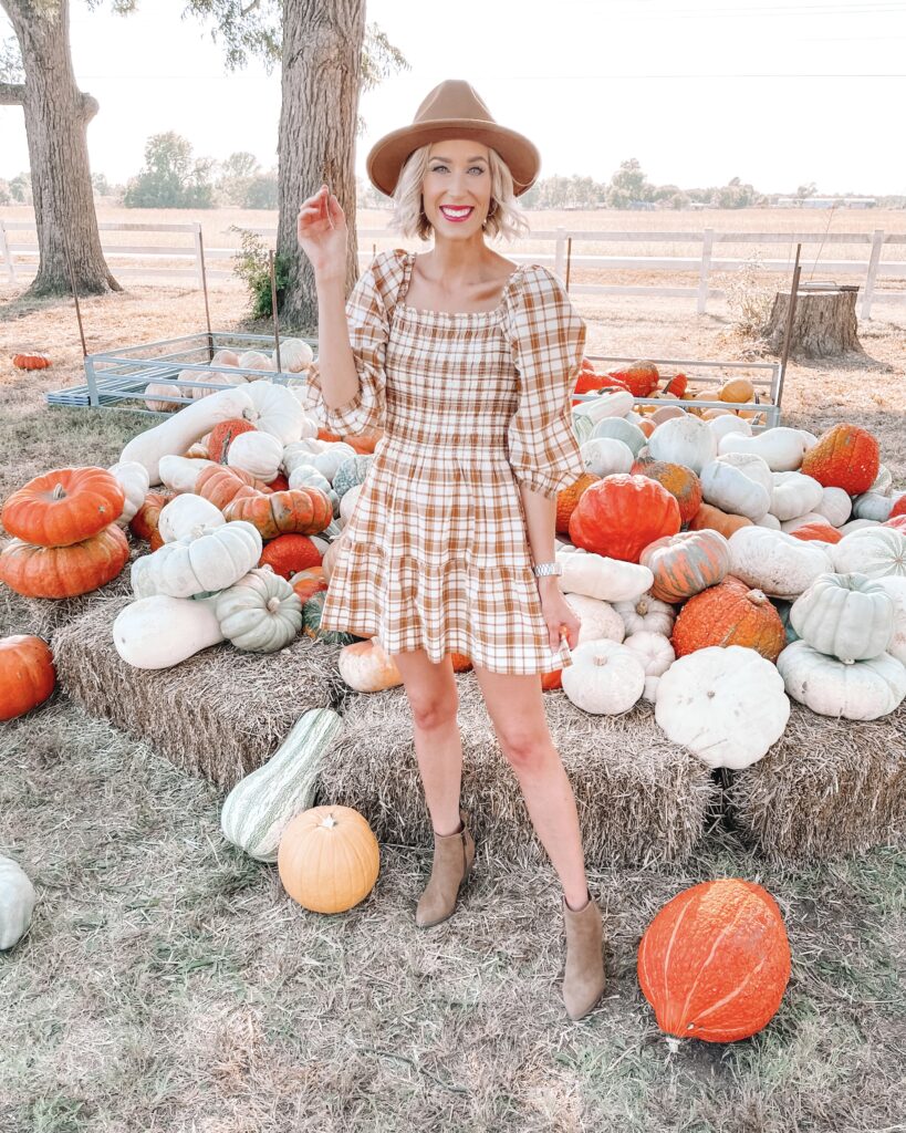 I found the cutest $32 smocked plaid dress for fall! Pair it with a short pair of ankle boots or a taller one as it cools off. 