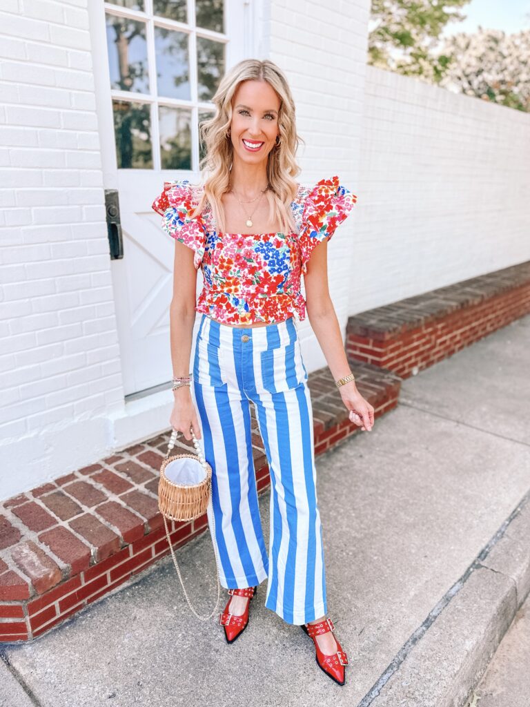 Looking for colorful outfit inspiration? You are in the right place! I love unexpected combinations, color, and print. These bold blue and white striped pants are so fun with this floral top and red shoes. 