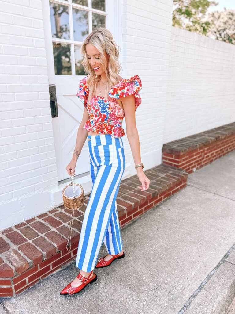 Looking for colorful outfit inspiration? You are in the right place! I love unexpected combinations, color, and print. These bold blue and white striped pants are so fun with this floral top and red shoes. 