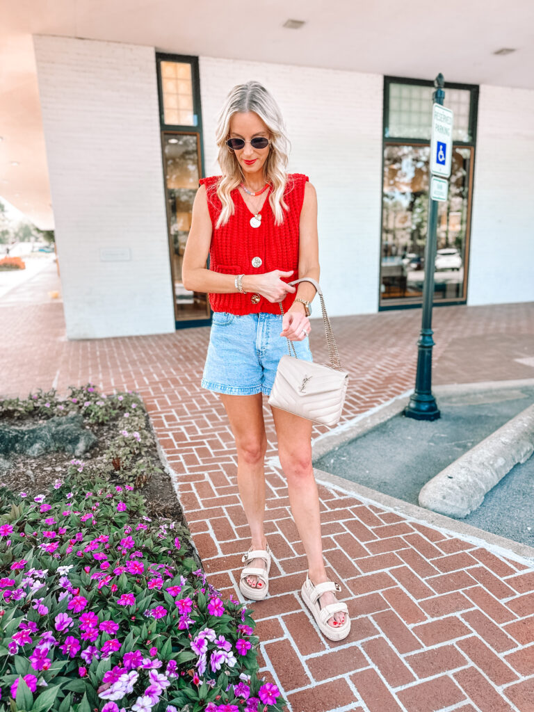 This red Amazon look for less sweater vest is just so good! You can style it with jean shorts, jeans, alone, or as a layer. 