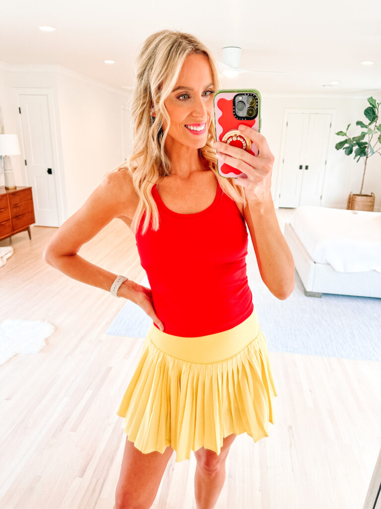 Sharing a fun Amazon try on haul with lots of cute, colorful items you will love! This red racerback tank top is the perfect workout top. 