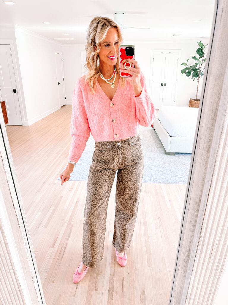 Leopard dresses, pants, tops, shoes, and more are all over. Today I am sharing how to wear leopard jeans including 5 different ways to style them. This pink sweater lends a girl touch.