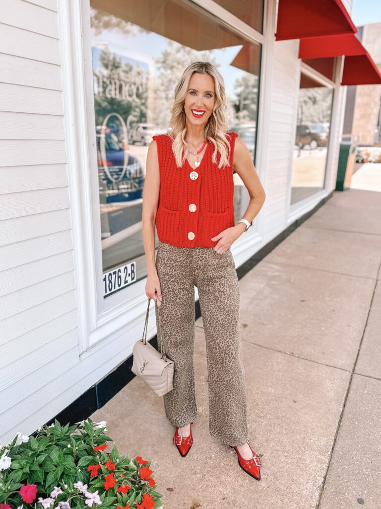 This red Amazon look for less sweater vest is just so good! You can style it with jean shorts, jeans, alone, or as a layer.  I love it here with leopard jeans. 