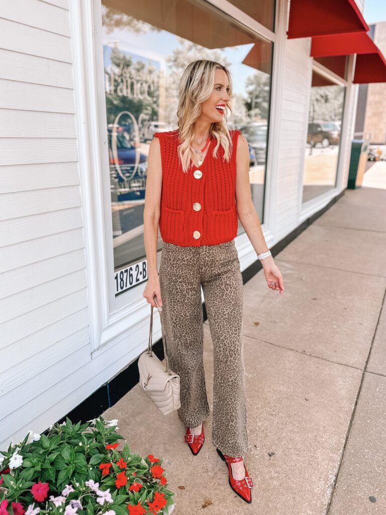 This red Amazon look for less sweater vest is just so good! You can style it with jean shorts, jeans, alone, or as a layer.  I love it here with leopard jeans. 