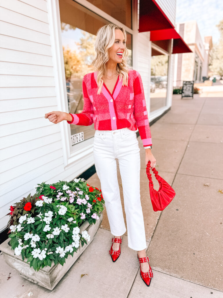 How amazing is this Amazon pink and red cardigan?! I styled it with cream jeans and red accessories for a fun fall look!